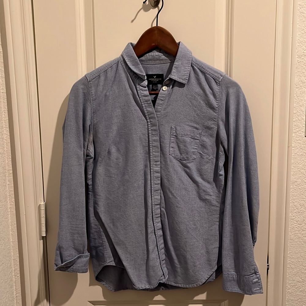 Womens blue button down shirt, pocket front. Very good condition, no stains.